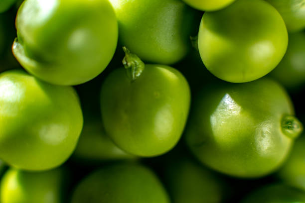 Green fresh peas, close-up texture.