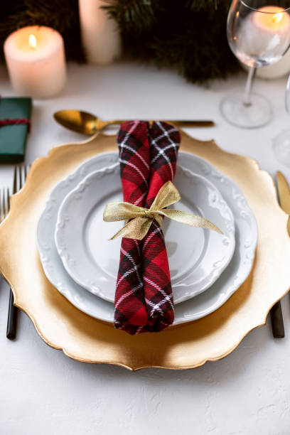 istock Beautiful Christmas table setting decorated with candles and fir. 1189989955
