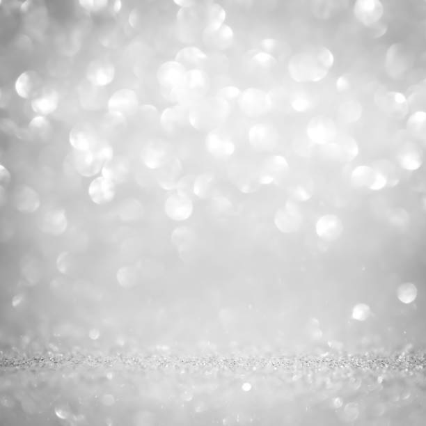 istock Abstract glitter bokeh on gray background 1189991373
