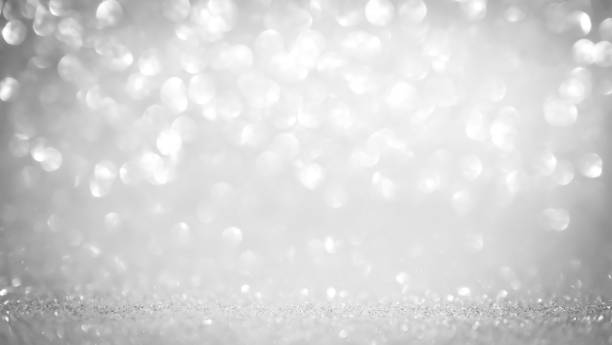 istock Abstract glitter bokeh on gray background 1189991404