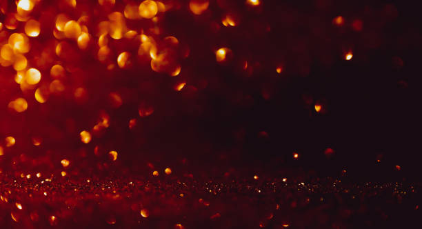 istock Defocused red abstract lights background with Christmas background 1189991624