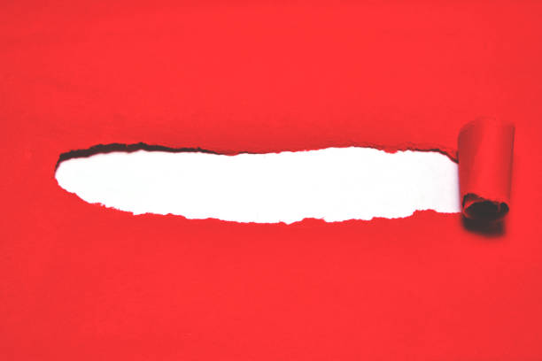 istock Red torn paper cover with white background. 1189991681