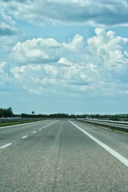 istock Empty highway asphalt road and beautiful sky sunset landscape 1189993044