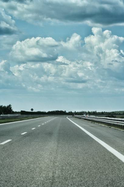 istock Empty highway asphalt road and beautiful sky sunset landscape 1189993162