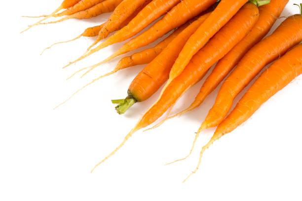 istock fresh carrots on white background 1189993215