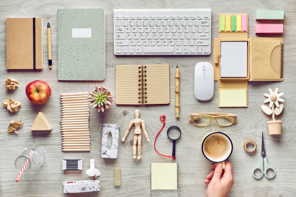 Concept flat lay with modern office supplies from eco friendly sustainable materials. Flat lay on office table without single use plastic to reduce waste at workplace. Concept flat lay with modern office supplies from eco friendly sustainable materials. Flat lay on office table without single use plastic to reduce single use disposable plastic waste at workplace. stapled paper stock pictures, royalty-free photos & images