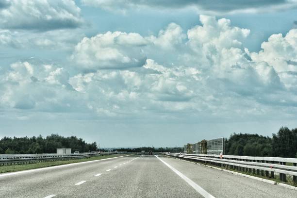 istock Empty highway asphalt road and beautiful sky sunset landscape 1189993349