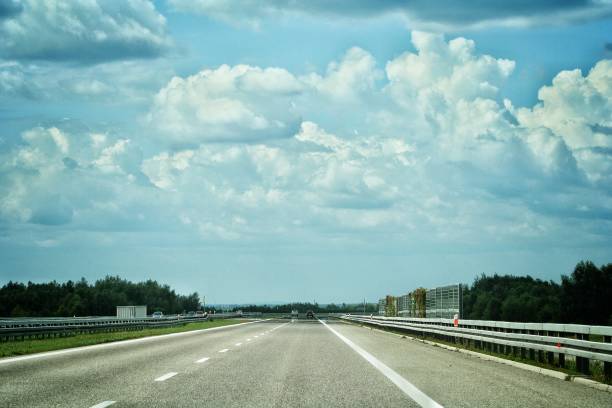 istock Empty highway asphalt road and beautiful sky sunset landscape 1189993402