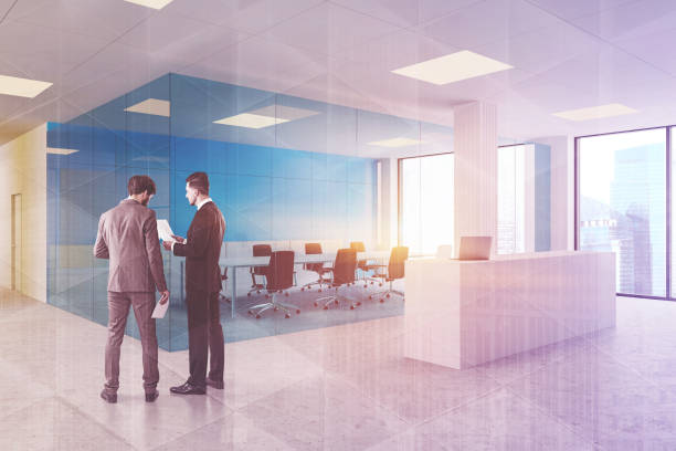 istock People in blue office with reception 1189996088
