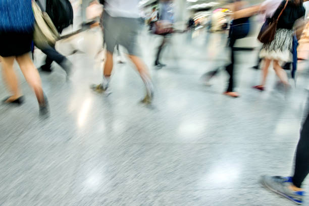 istock Blurred people leg walking in subway station 1189996383