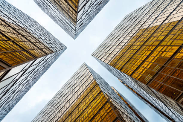 istock Looking up at golden skyscrapers 1189996389