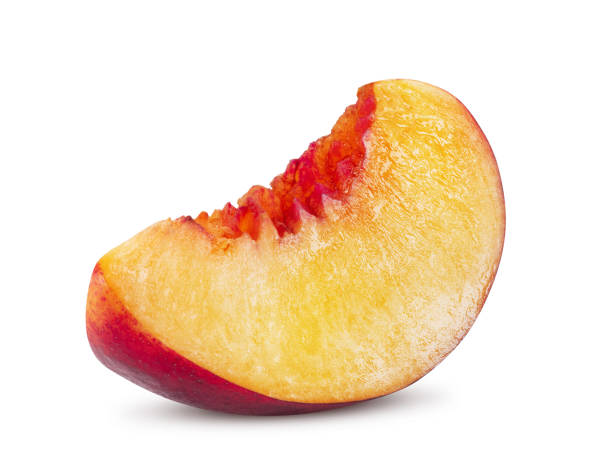 istock Unpitted, smooth-skinned nectarine fruit slice isolated on white background with copy space for text or images. Close-up shot 1189996733