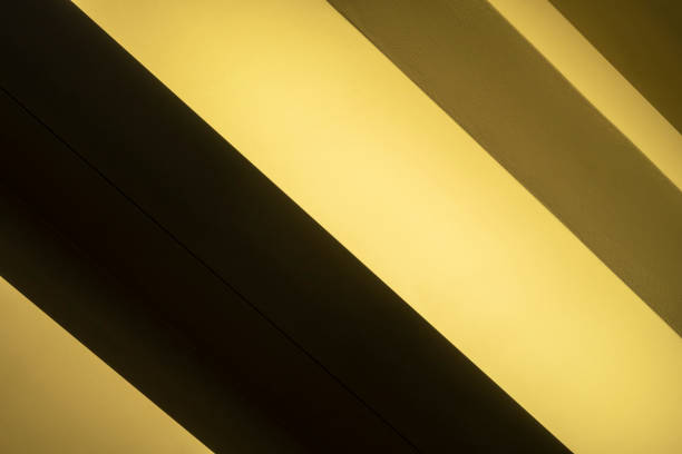 istock Striped background. Yellow shadows color scheme. 1189996786