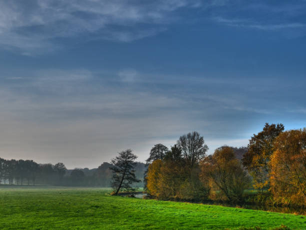 istock autumn at a river in germany 1189997467