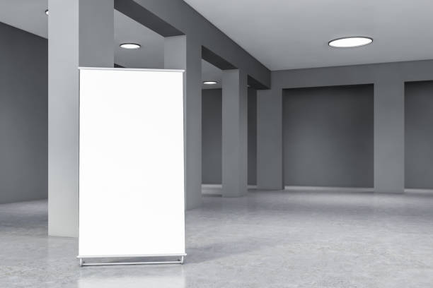 istock Gray empty office hall with columns and poster 1189998859