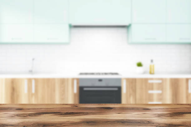 istock Blurry white brick kitchen with wooden countertops 1189998992