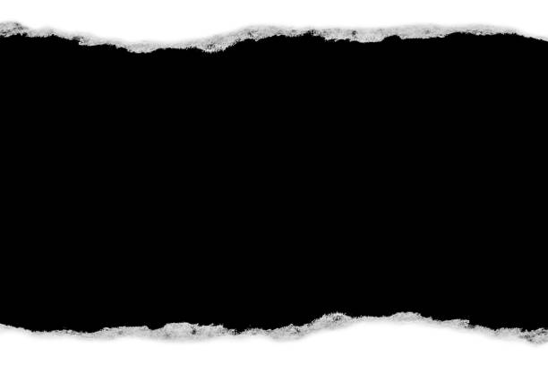 istock White paper with torn edges isolated with a black isolated background inside. 1190001507