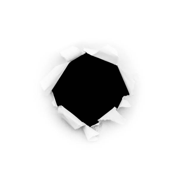 istock A round hole in white paper with torn edges isolated on a white background with a black isolated background inside. 1190001537
