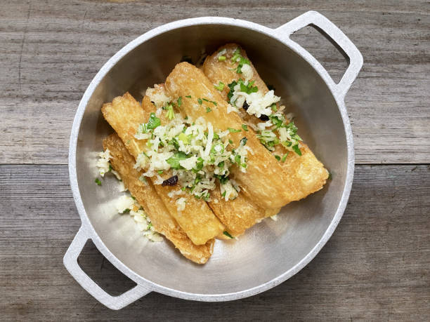 Fried Yucca Fried Yucca dish in a skillet puerto rican culture stock pictures, royalty-free photos & images