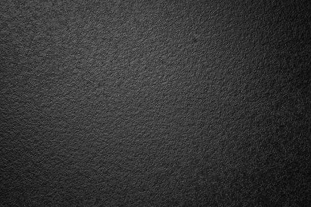 istock Abstract black textured faded wall background 1190003936