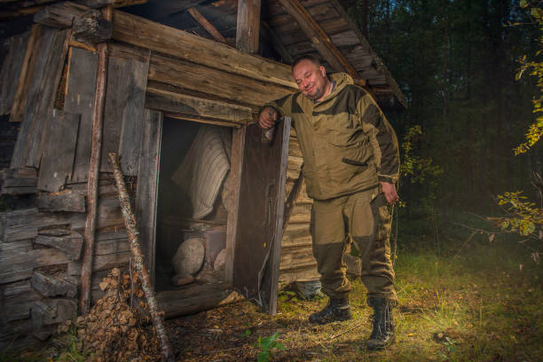istock A man at an abandoned hunting hut. 1190003980