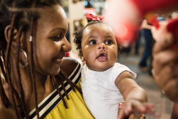 istock fascinated baby at the toy store 1190005395