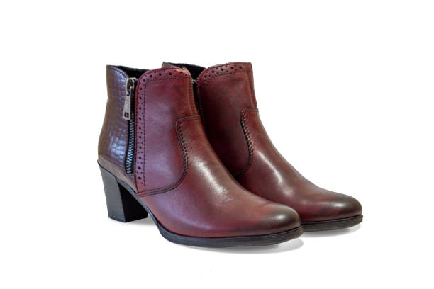 istock modern women's ankle boots rich red-brown color. side view. isolated on a white background. 1190007039