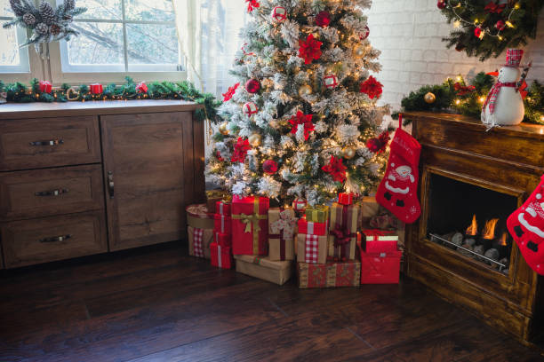 istock Decorated Christmas Tree Near Fireplace at Home 1190007275