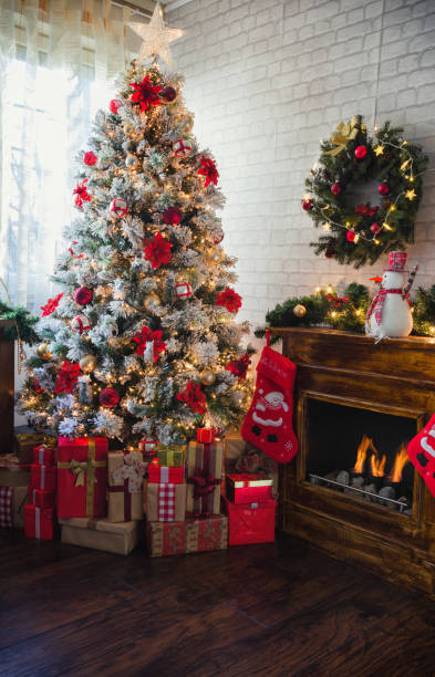istock Decorated Christmas Tree Near Fireplace at Home 1190007370