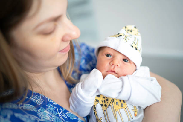istock Emotional mom holding her newborn 1190008351