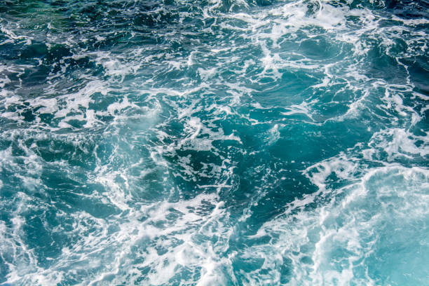 istock Blue sea water with white foam 1190012654