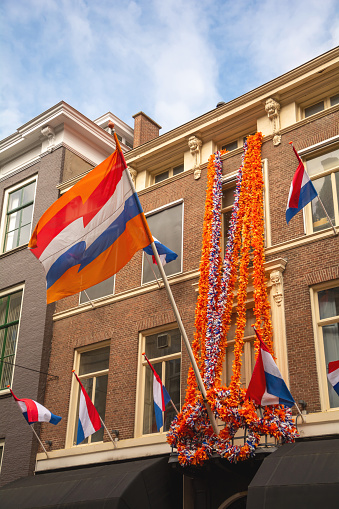 King's Day celebration in The Hague. The house is decorated with a national Dutch flag and orange garlands.
