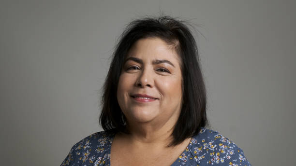 istock Mature woman posing looking at the camera smiling (real latino women) 1190018829