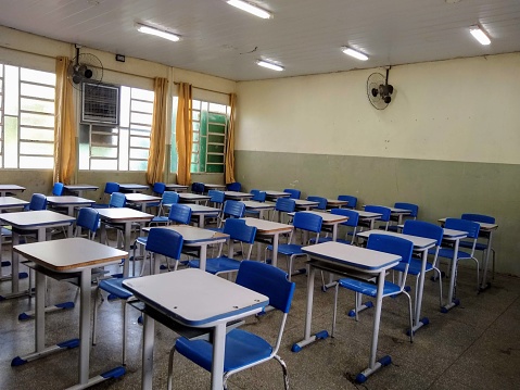 Classroom desks lined up ready to start classes at a school in Brazil.