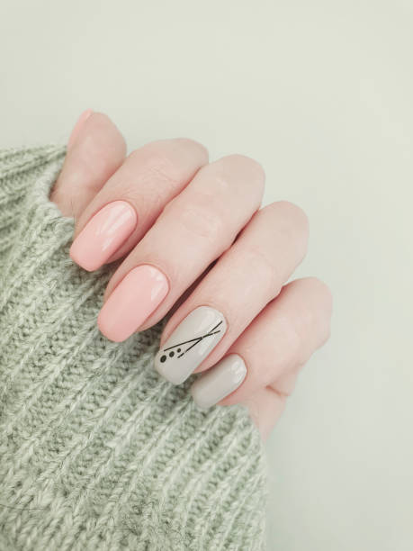 istock female hand beautiful stylish manicure sweater 1190026593