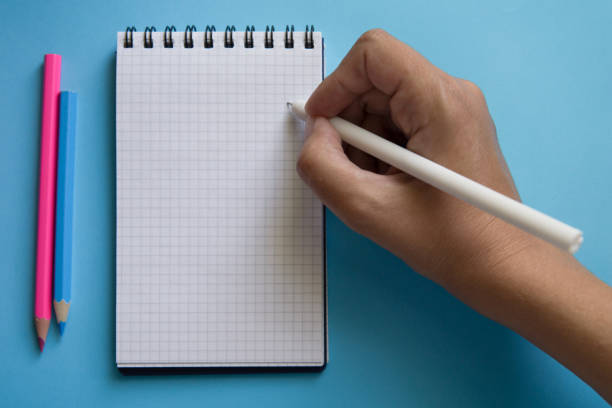 istock Various stationery and notebook on a two color background. 1190029186
