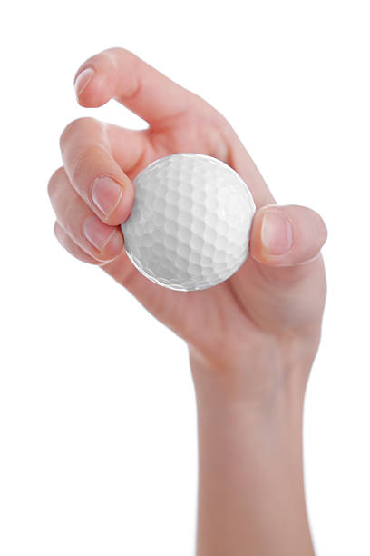 istock female hand holding golf ball isolated on white 119003000