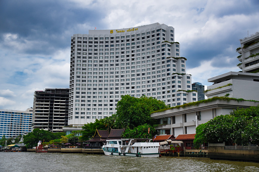 Bangkok, Thailand - November 24, 2019: View of the main building of the luxury and exclusive Shangri-La Hotel alongside the Chao Phraya River