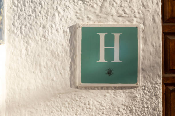 istock one star hotel sign on white wall 1190031164