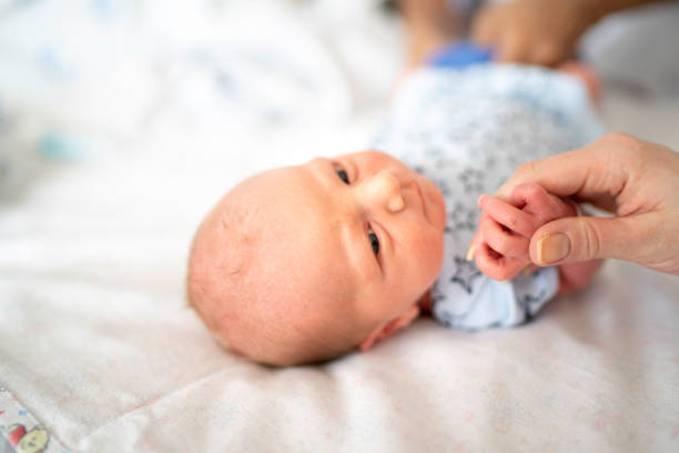 istock Newborn holding mother's hand 1190033484