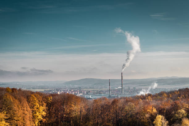 istock Coal power plant with smoking chimney and sky 1190034115