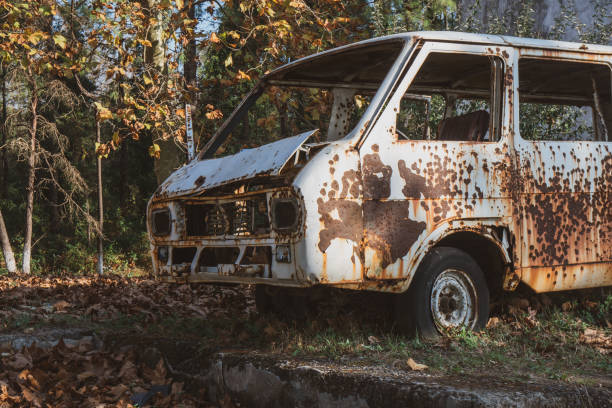 istock Old abandoned rusty car in a park. 1190036526