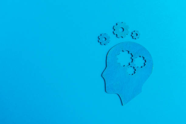 istock Brain works concept. Thinking, creativity concept of the human head with gears on blue background 1190038178