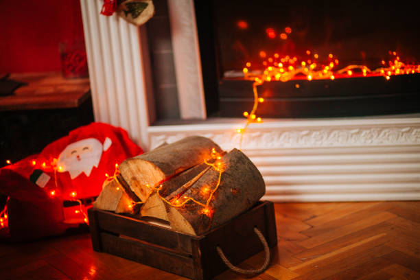 istock Christmas stockings, fireplace, tree, and decorations 1190038681