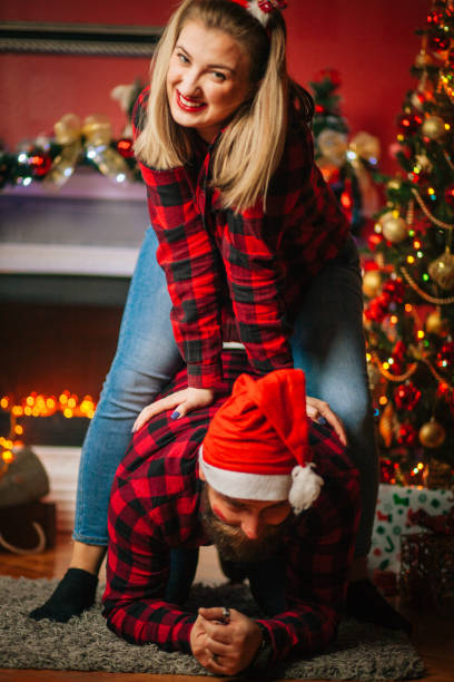 istock Young Couple Having A fun At Home For Christmas 1190039388