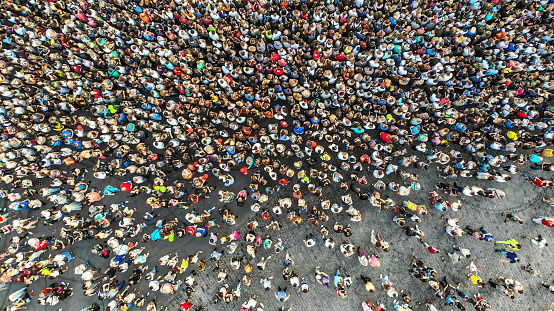 Aerial. Interested crowd of people in one place. Top view from drone.