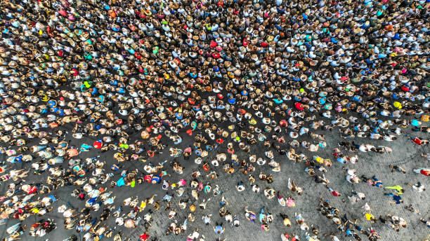 Aerial. Interested crowd of people in one place. Top view from drone. Aerial. Interested crowd of people in one place. Top view from drone. revolution photos stock pictures, royalty-free photos & images