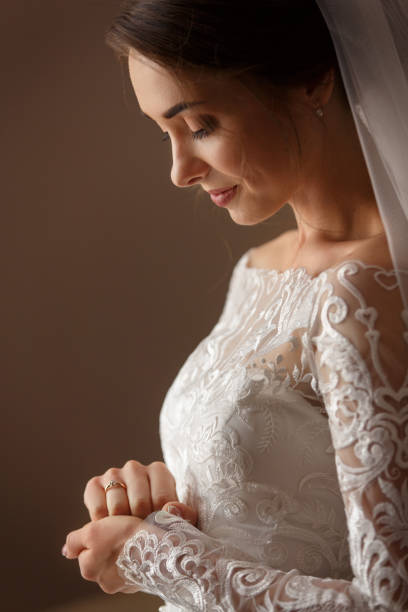 istock Wedding day. Georgeous bride holding hands with engagement ring. Marriage concept 1190043317