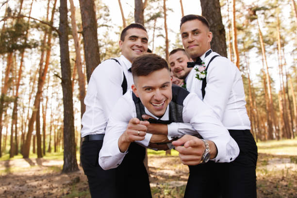istock Groom and groomsmen having fun at wedding day 1190043320