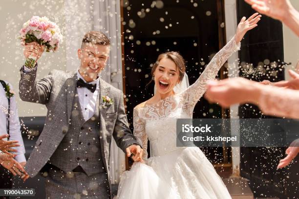 Happy Wedding Photography Of Bride And Groom At Wedding Ceremony Wedding Tradition Sprinkled With Rice And Grain Stock Photo - Download Image Now